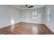 Spacious living room featuring wood floors and a view to the yard from two large windows for natural light at 3159 Nursery Se Rd, Smyrna, GA 30082