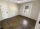 Bedroom with hardwood floors and exterior access door at 1288 Fairhill Ne Ln, Brookhaven, GA 30319