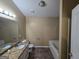 Bathroom with granite vanity and bathtub at 883 Pine Shoals Dr, Atlanta, GA 30349