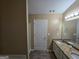 Bathroom with double vanity, granite countertop, and shower at 883 Pine Shoals Dr, Atlanta, GA 30349