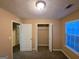 Bright bedroom with closet and carpet at 883 Pine Shoals Dr, Atlanta, GA 30349