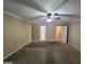 Spacious bedroom with ceiling fan and carpet at 883 Pine Shoals Dr, Atlanta, GA 30349
