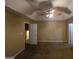 Large bedroom with ceiling fan and carpet at 883 Pine Shoals Dr, Atlanta, GA 30349