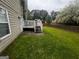 House back view with deck and backyard at 883 Pine Shoals Dr, Atlanta, GA 30349