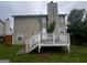 House back, deck, and backyard view at 883 Pine Shoals Dr, Atlanta, GA 30349