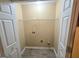 Laundry closet with shelving and hookups at 883 Pine Shoals Dr, Atlanta, GA 30349