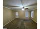 Living room with carpet and door access at 883 Pine Shoals Dr, Atlanta, GA 30349
