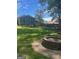 Spacious backyard with a stone fire pit and well-maintained lawn at 3705 Sandhill Se Dr, Conyers, GA 30094