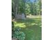 Backyard view with a storage shed at 3705 Sandhill Se Dr, Conyers, GA 30094