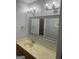 Bathroom with tile floors, vanity with marble countertop, and large mirror at 3705 Sandhill Se Dr, Conyers, GA 30094