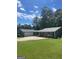 Ranch-style home with an attached two-car garage and a well-manicured lawn at 3705 Sandhill Se Dr, Conyers, GA 30094