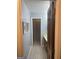 Hallway with tile floors and a view into the bathroom at 3705 Sandhill Se Dr, Conyers, GA 30094