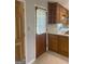 Classic kitchen featuring wood cabinets, white countertops, and tile flooring at 3705 Sandhill Se Dr, Conyers, GA 30094