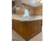 Kitchen with tile floors, a center island, and wood cabinets at 3705 Sandhill Se Dr, Conyers, GA 30094
