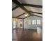 Living room with hardwood floors, and a ceiling fan with exposed beams at 3705 Sandhill Se Dr, Conyers, GA 30094