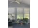 Cozy sun room with multiple windows and plants at 3705 Sandhill Se Dr, Conyers, GA 30094