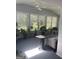 Bright sunroom with multiple windows, a skylight, and multiple plants creating a tranquil retreat at 3705 Sandhill Se Dr, Conyers, GA 30094