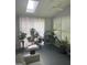 Bright sunroom with large windows, skylight, and various plants, creating a cozy and inviting atmosphere at 3705 Sandhill Se Dr, Conyers, GA 30094