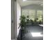 Sunroom filled with plants features a skylight and multiple windows for an abundance of natural light at 3705 Sandhill Se Dr, Conyers, GA 30094