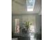 Bright sunroom with a skylight, multiple windows and indoor plants creating a bright and airy feel at 3705 Sandhill Se Dr, Conyers, GA 30094