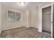 Neutral bedroom with gray carpet, trim, and access to closet at 2576 Godfrey Nw Dr, Atlanta, GA 30318