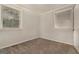 Comfortable bedroom with neutral carpeting, and natural light from multiple windows at 2576 Godfrey Nw Dr, Atlanta, GA 30318