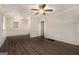 Bright living room with new hardwood flooring, fresh paint, and a modern ceiling fan at 2576 Godfrey Nw Dr, Atlanta, GA 30318