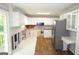 Bright kitchen featuring stainless steel appliances, and white cabinets at 5883 Margaret Cir, Atlanta, GA 30349