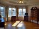 Sunlit bedroom with a view of the water, featuring hardwood floors and traditional decor at 0 Hawkins Academy Rd, Social Circle, GA 30025
