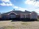 Brick ranch house with attached garage and large yard at 0 Hawkins Academy Rd, Social Circle, GA 30025