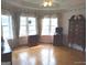 Spacious main bedroom with bay window, hardwood floors, and built-in dresser at 0 Hawkins Academy Rd, Social Circle, GA 30025