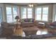 Cozy sunroom with wicker furniture, large windows offering natural light, and floral wallpaper at 0 Hawkins Academy Rd, Social Circle, GA 30025