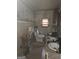 Dated bathroom with tiled walls, double sinks, and an open toilet at 212 Little St, Atlanta, GA 30315