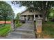 Inviting home showcasing a quaint porch, columns, and easy access concrete pathway at 212 Little St, Atlanta, GA 30315