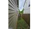 Narrow side yard with a small banana tree and wooden fence at 212 Little St, Atlanta, GA 30315