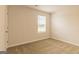 Neutral bedroom with a window and tan carpet in a new home at 1613 Fuma Leaf Way # 273, Mcdonough, GA 30253