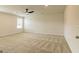 Large main bedroom featuring plush carpet, neutral walls, ceiling fan, and natural light at 1613 Fuma Leaf Way # 273, Mcdonough, GA 30253