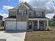 Beautiful brick home with a two car garage and well manicured lawn at 1613 Fuma Leaf Way # 273, Mcdonough, GA 30253