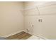 Bright laundry room featuring hard floors, white walls, and wire shelving at 1613 Fuma Leaf Way # 273, Mcdonough, GA 30253
