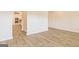 Spacious living room featuring hardwood floors, white walls and natural light at 1613 Fuma Leaf Way # 273, Mcdonough, GA 30253