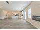 Open-concept living space with a modern fireplace, kitchen, and dining area at 1613 Fuma Leaf Way # 273, Mcdonough, GA 30253