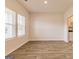 Bright living room with hardwood floors and large windows at 1613 Fuma Leaf Way # 273, Mcdonough, GA 30253