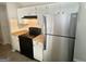 This kitchen features black appliances and light colored countertops and cabinets at 110 Peridot Pl, South Fulton, GA 30349