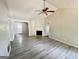 Living room with a fireplace and modern flooring at 110 Peridot Pl, South Fulton, GA 30349