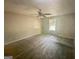 Neutral Primary bedroom with a ceiling fan and a window at 110 Peridot Pl, South Fulton, GA 30349