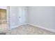 Bedroom with neutral carpet and view to bathroom at 6116 Ripple Way # 47, South Fulton, GA 30349