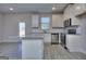 Modern kitchen featuring stainless appliances, ample counter space, and white cabinets at 6116 Ripple Way # 47, South Fulton, GA 30349