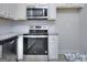 Kitchen with stainless steel appliances, granite countertops, and subway tile backsplash at 6116 Ripple Way # 47, South Fulton, GA 30349