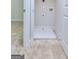 Small laundry area with a drain pan, washer hookups, and tile flooring at 6116 Ripple Way # 47, South Fulton, GA 30349