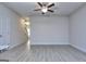 Large living room area with wood-look flooring, neutral paint and ceiling fan at 6116 Ripple Way # 47, South Fulton, GA 30349